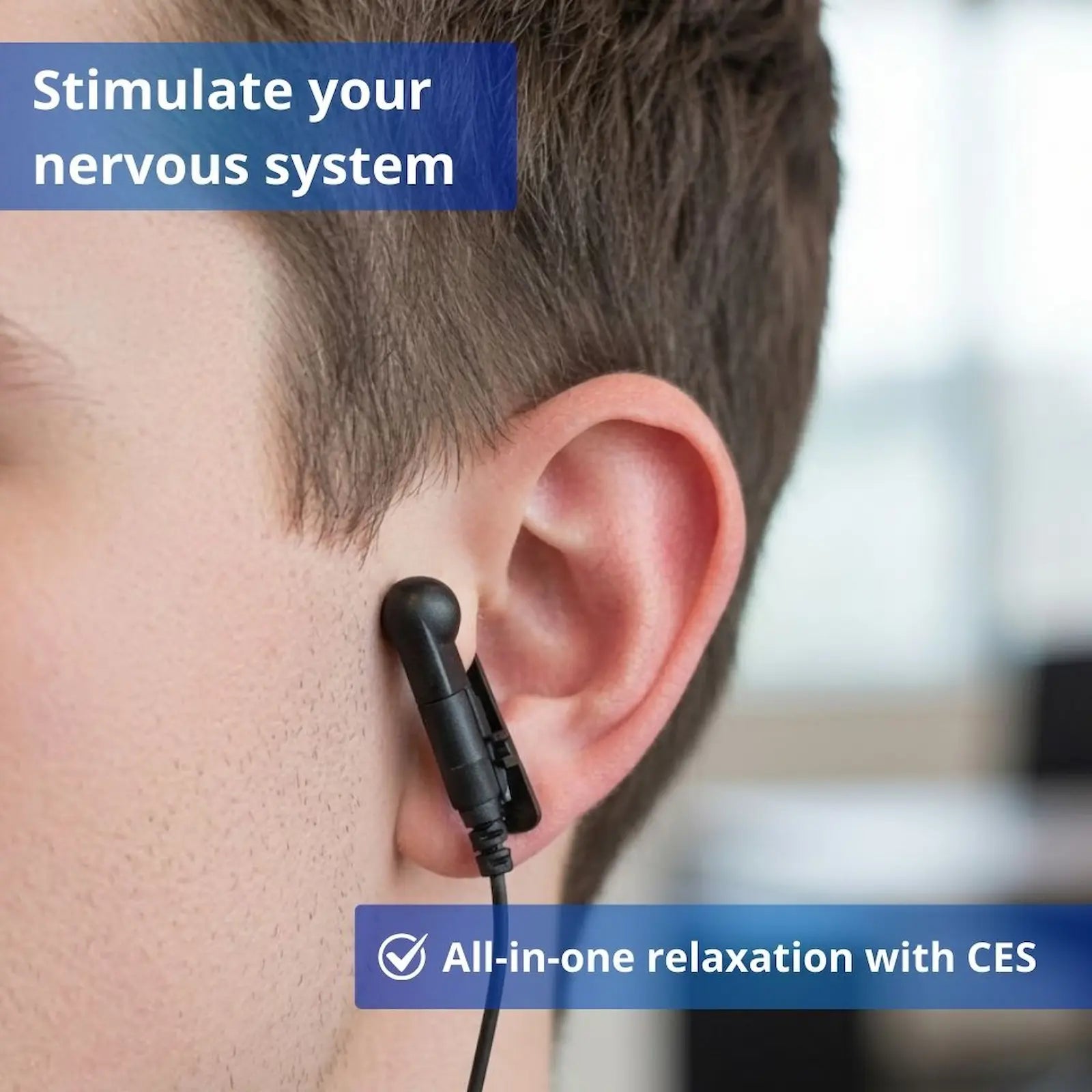 Close-up of a CES ear clip placed on the ear during a DAVID Delight Pro session.